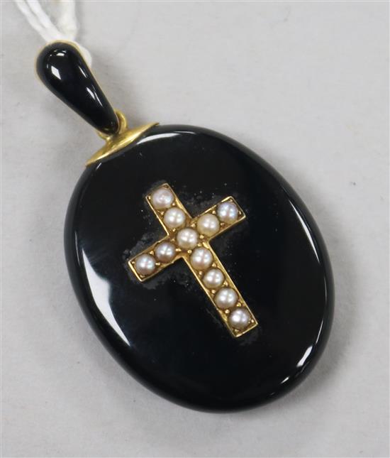 A Victorian gold enamel and seed pearl set oval mourning pendant locket, overall 41mm.